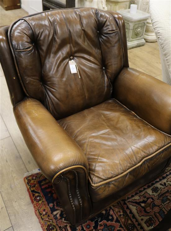 A Pegasus brown leather armchair
